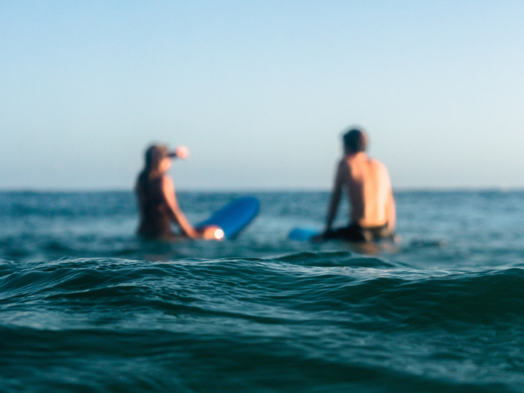 Surf coaches in the water at Mount Maunganui
