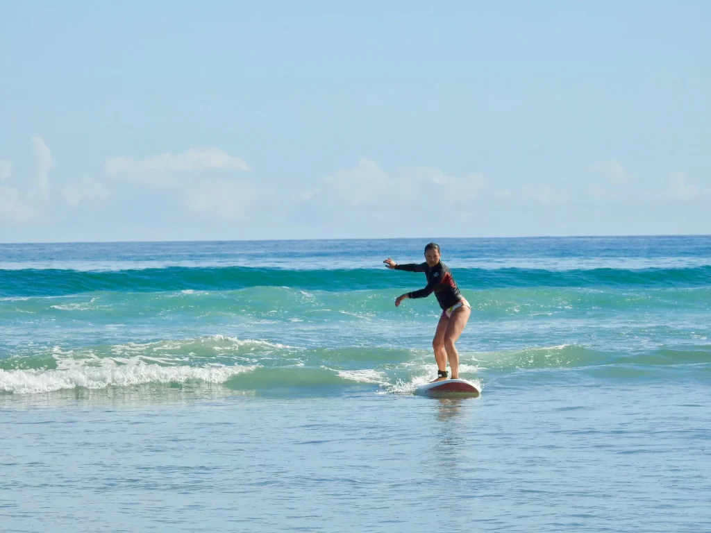 Surf coach with beginners on Main Beach, Mount Maunganui